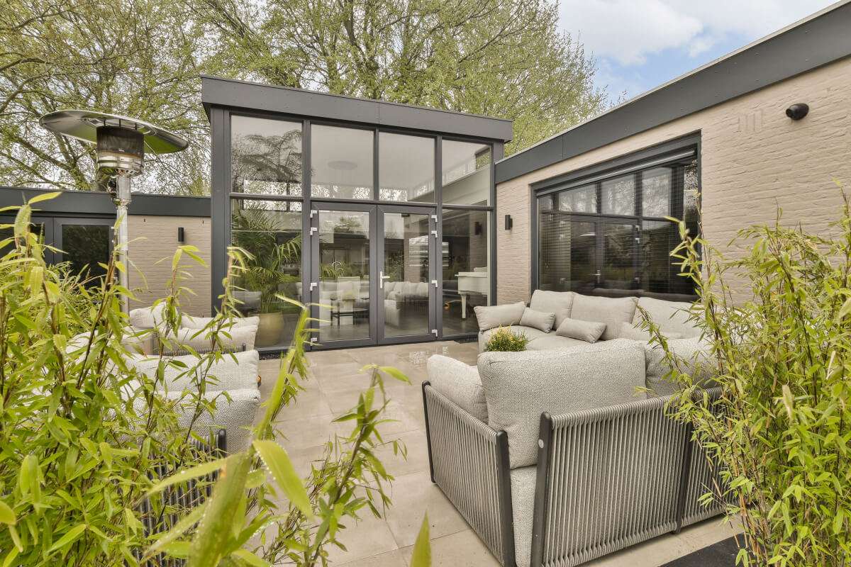 a-living-room-with-a-couch-and-a-chair-on- AUENRHF